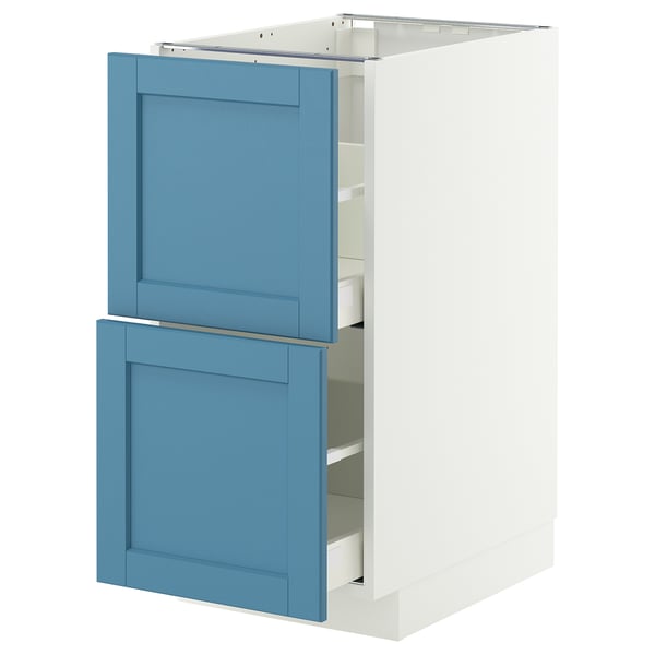 A blue and white kitchen cabinet with two drawers open, displaying its internal shelves.