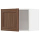 Ikea METOD kitchen cabinet in walnut wood color with white interior.