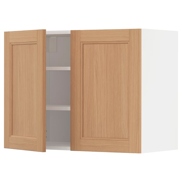 Oak METOD kitchen cabinet with adjustable shelves, light wood colour.
