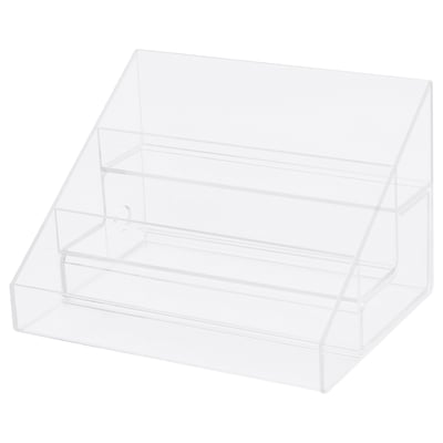 A clear acrylic nail polish storage stand with 24 compartments in 3 tiers, plus a drawer for tools.