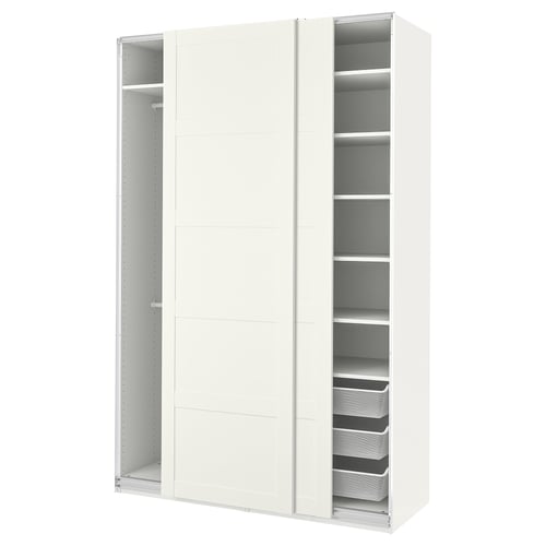 A white PAX wardrobe with sliding doors and internal storage shelves.