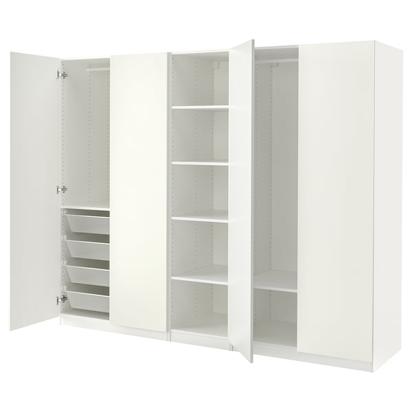 A white ikea PAX wardrobe with open doors, revealing shelves and a basket.