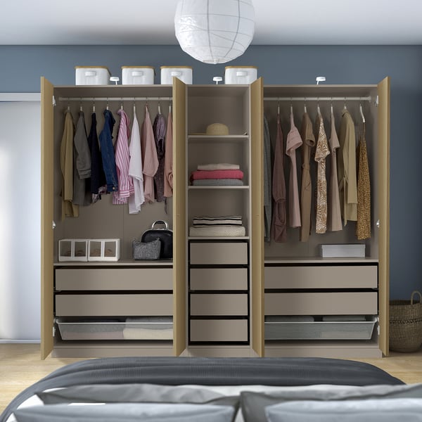 Closed wardrobe with clothes, accessories, and drawers, featuring mesh baskets for air circulation and adjustable feet for floor irregularities.