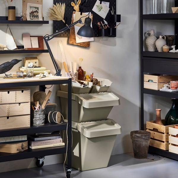 Two grey SORTERA bins stacked in workspace.