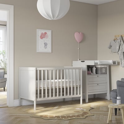 SUNDVIK white baby cot, minimalist nursery with heart decor.