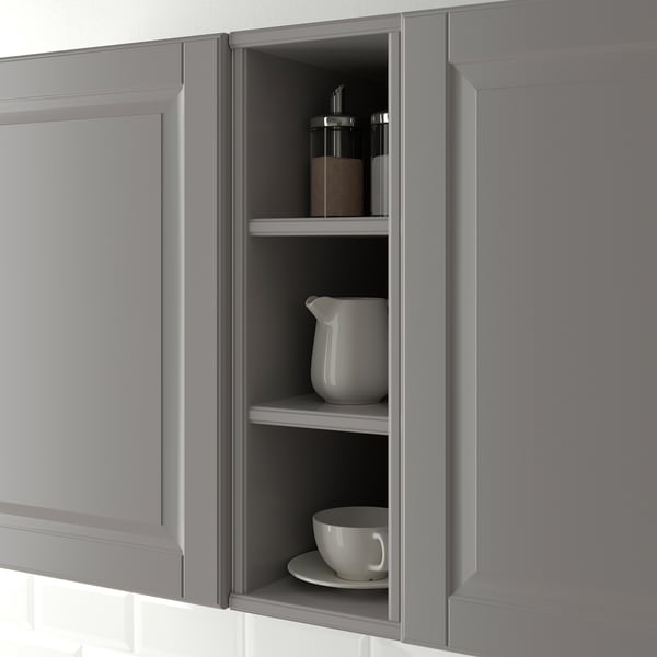 Open kitchen cabinet displaying items, part of the TORNVIKEN series.