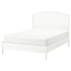 White TYSSEDAL bed, sleek design, wooden spindles, sturdy headboard.