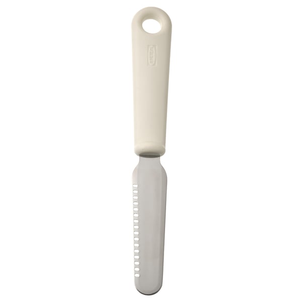 A beige kitchen tool named UPPFYLLD. It has a plastic handle and a stainless steel blade with holes. Used for spreading and decorating.