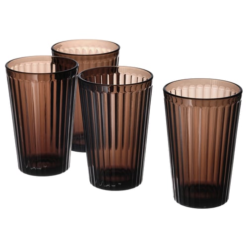 Four brown, tall, highball glasses with vertical grooves, arranged together. Made of durable tempered glass.
