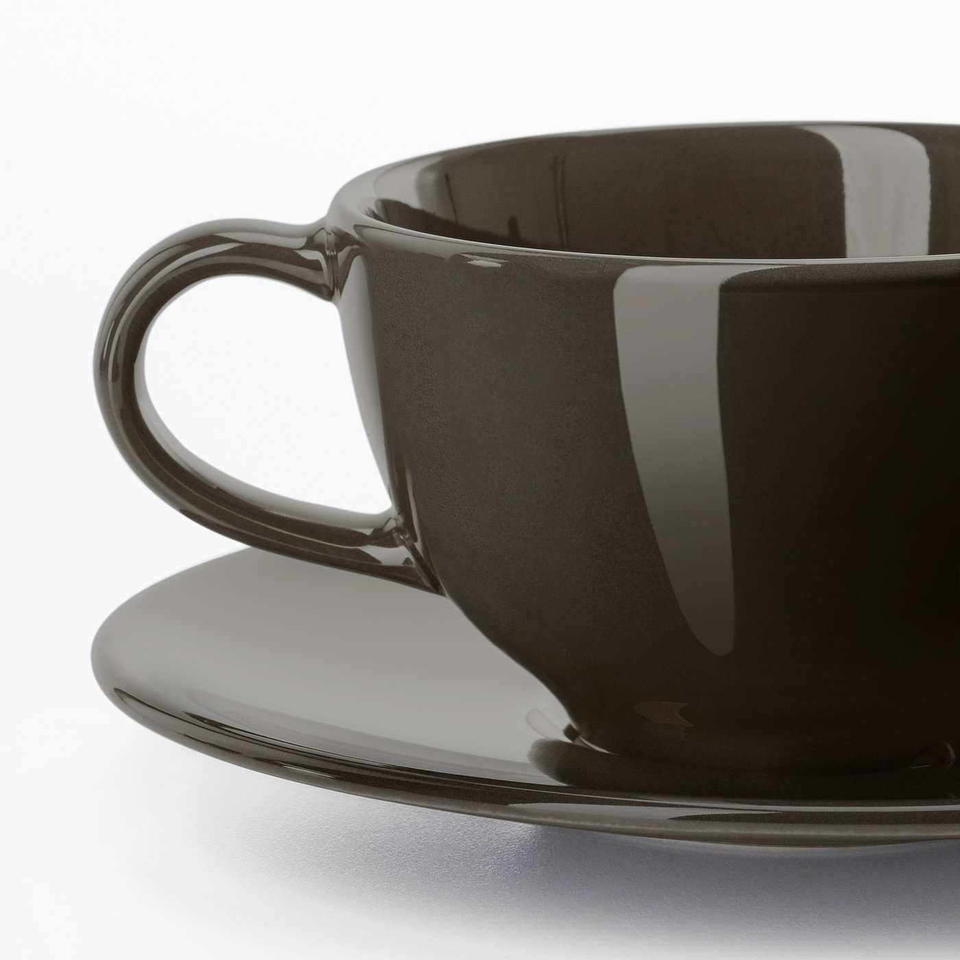 Black glossy coffee cup with matching saucer. High-quality, smooth, and reflective surface. Round handle for comfortable grip.