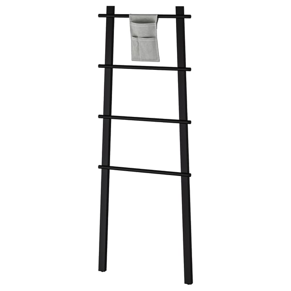 Black wooden towel rack with fabric pocket, sleek ladder design, ideal for small spaces.