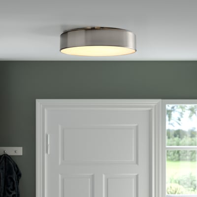 Ceiling light, white, light on, above door, modern style.