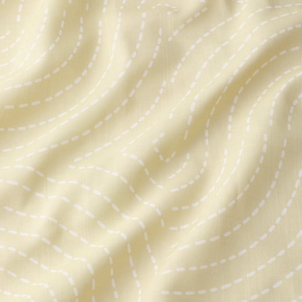 Yellow curtains with wavy white patterns, soft light filtration.