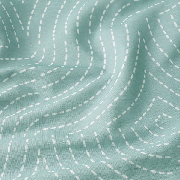 Soft, textured sea green curtains with white patterns, likely recycled polyester, draped neatly.