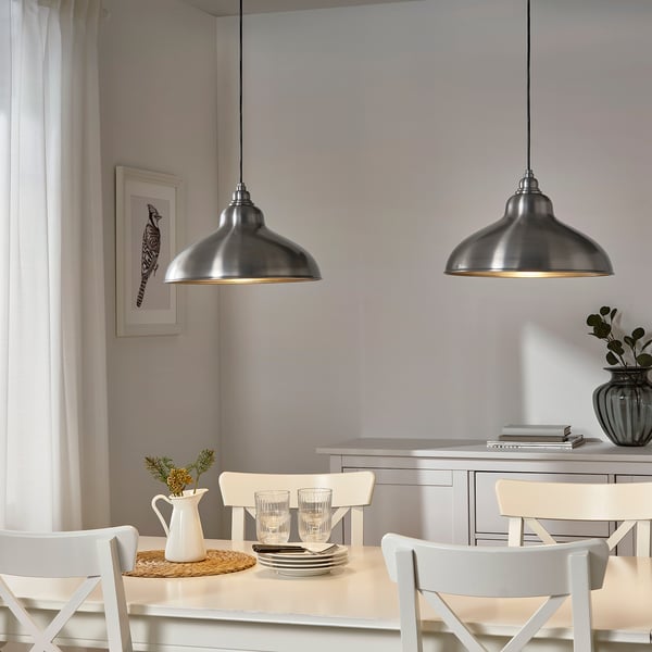 Two ANKARSPEL lamps over dining table with white curtains.