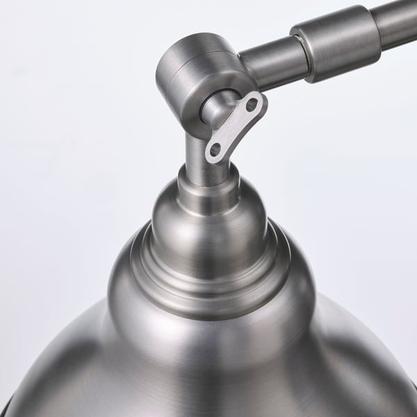Stainless steel lamp with adjustable joint. High-quality, sleek design.