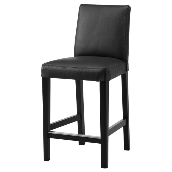 The BERGMUND bar stool is sleek & modern, featuring a black leather seat & back, sturdy metal legs, and a footrest for comfort.