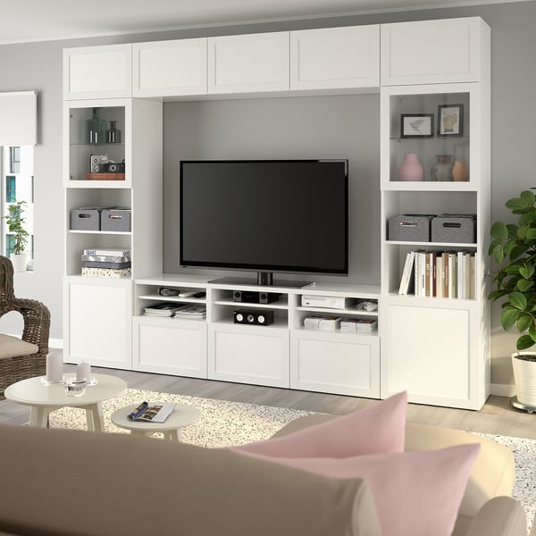 White BESTÅ tv unit with shelves and cabinets.