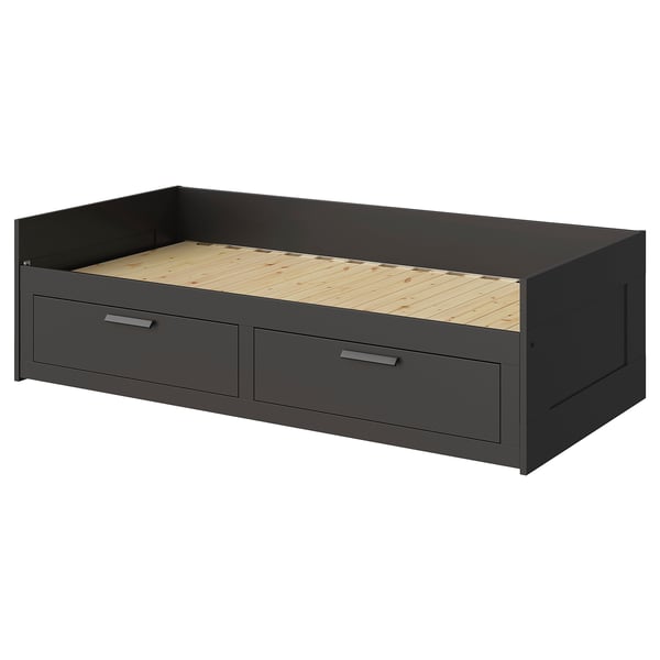An ikea BRIMNES gray daybed with two drawers, made of engineered wood and particleboard for storage.
