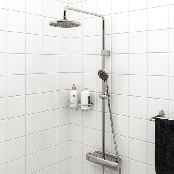 Modern BROGRUND chrome shower set: large overhead & handheld showers, tiled wall, built-in shelf for shampoo