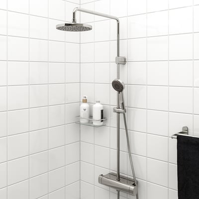 Modern BROGRUND chrome shower set: large overhead & handheld showers, tiled wall, built-in shelf for shampoo
