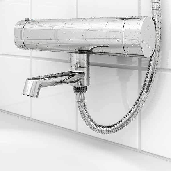 Image shows chrome shower mixer with attached hose. Safety stop at 38°c, cold touch for safety, and adjustable flow.