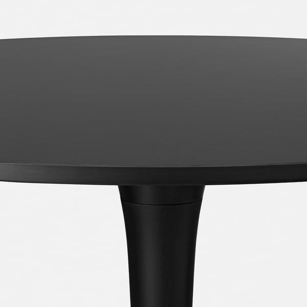 Sleek round black table top, supported by single central column base.