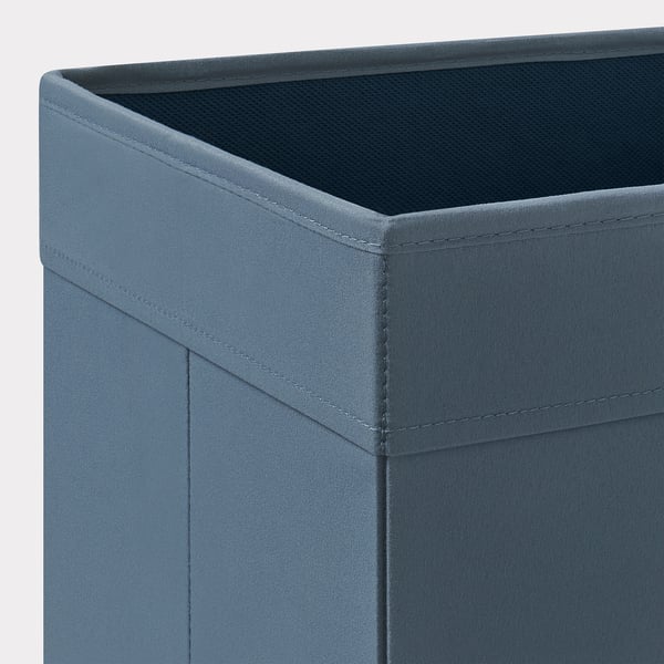 A close-up of a fabric storage box corner, showcasing its sturdy stitching and quality material.