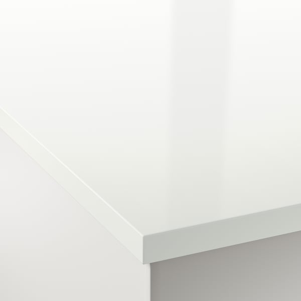 A sleek, white countertop with smooth, rounded edges, showcasing a high-quality, durable laminate surface.