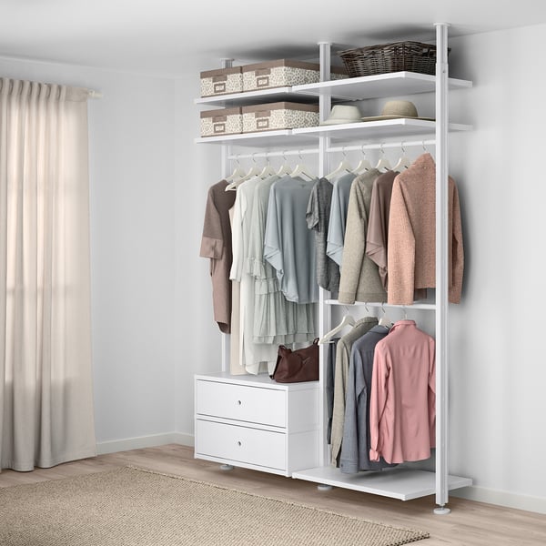 ELVARLI white wardrobe, hanging clothes, shelves with boxes, hats, against wall.