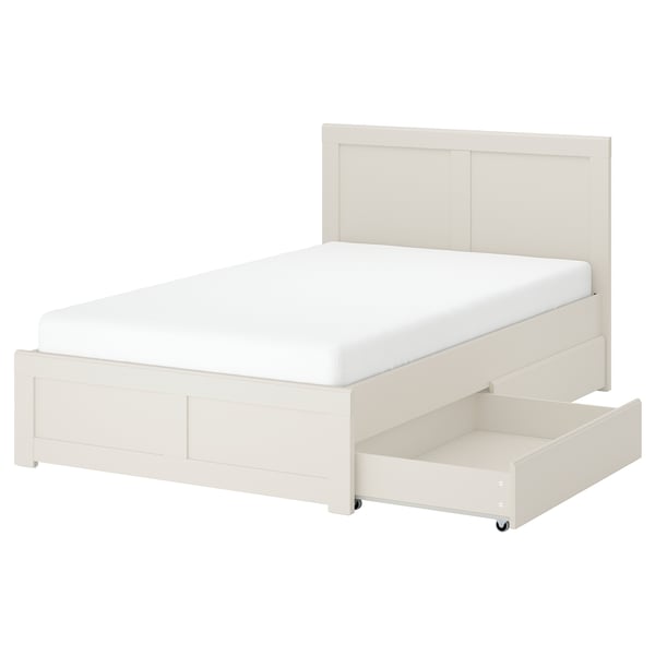 A white FÅGELFJÄLLET bed with storage drawers and a slatted base. The bed classic, panel designs on the headboard and footboard.