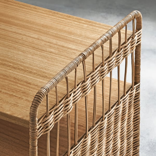 Handwoven rattan on wooden bench; natural, high-quality material.
