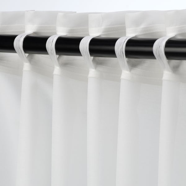 White curtains with rod pocket, light-filtering, privacy.