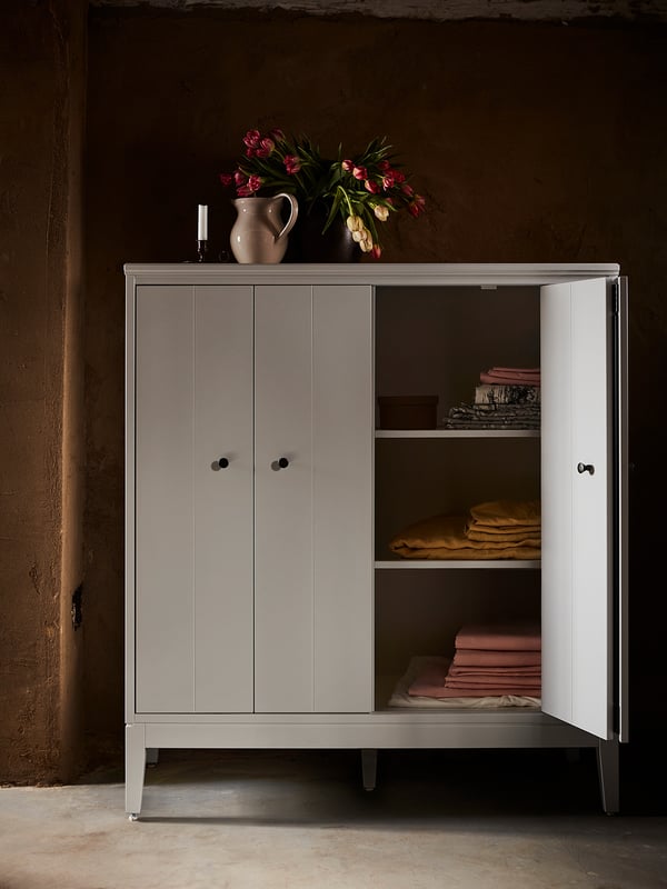 Modern cabinet, IDANÄS, light pink, metal, rectangular, minimalist design.