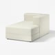 A white JÄTTEBO modular sofa with a chaise longue, featuring a soft and comfortable design with clean lines and a bouclé fabric cover.