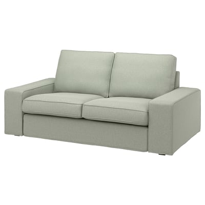 KIVIK sofa: compact, grey, plush. Angled design with low armrests.