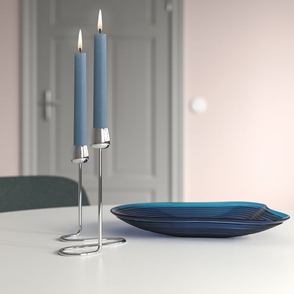 KLOKHET dual blue candles on silver holder, small. On table with glass dish, elegant setting.