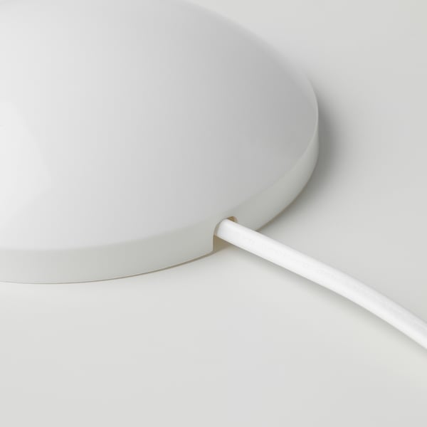 A white KOPPLA extension cord with a ceiling cup, highlighting its sleek design and long cable for easy reach.