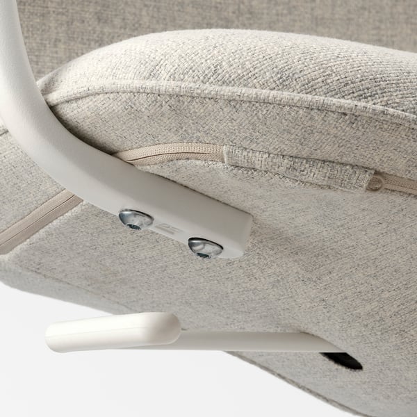 Close-up of an office chairs armrest. Smooth, white surface with silver bolts, attached securely to upholstered seat.