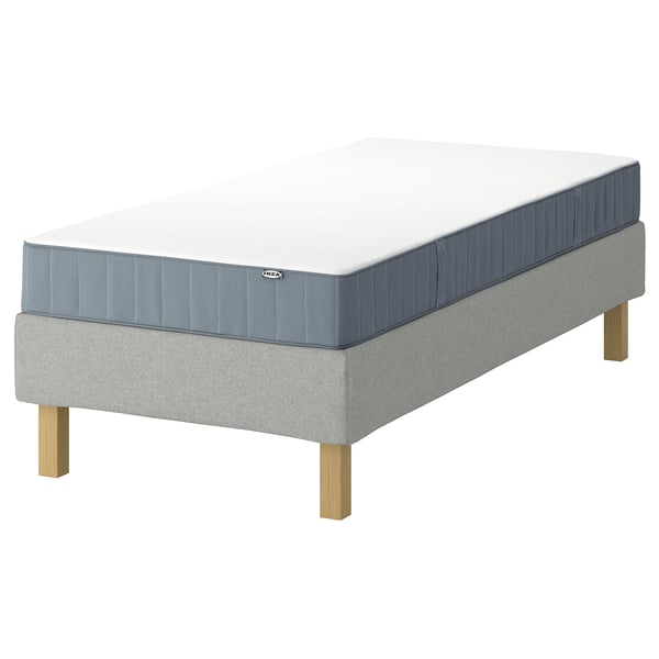 Image shows LYNGÖR bed base with vesteröy mattress, light grey, wooden legs, rectangular, simple design.