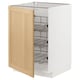 A white kitchen cabinet with wooden door open, revealing wire shelves inside.