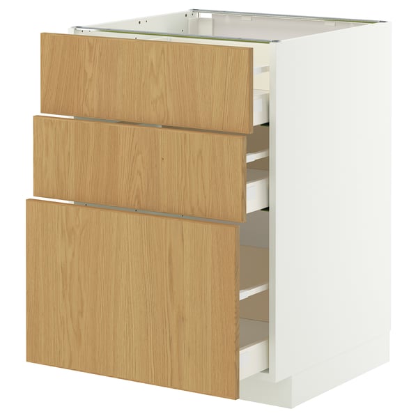 A METOD kitchen unit with three light oak drawers and a white cabinet base.