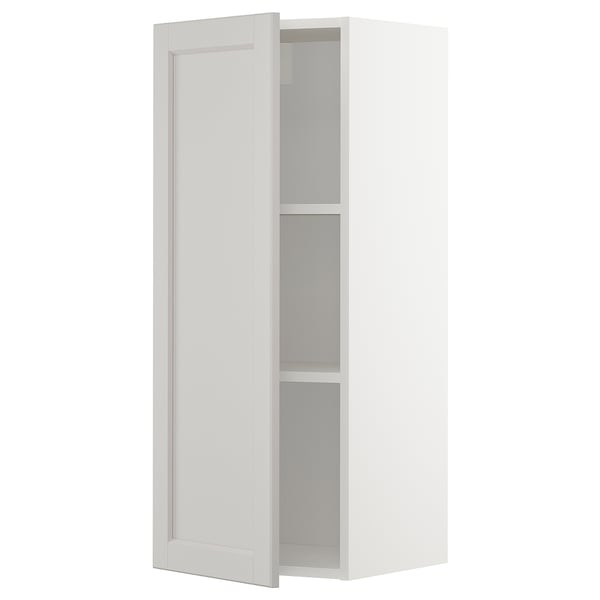 A white METOD wall cabinet with light gray lerhyttan doors, featuring a traditional design with beveled edges and an adjustable shelf.