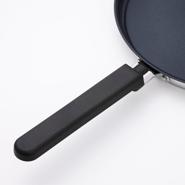 Black pancake pan, non-stick ceramic, durable base.