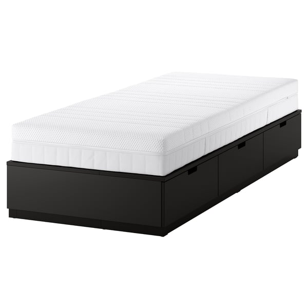 A NORDLI black bed frame with 3 drawers and a white mattress, perfect for small spaces.