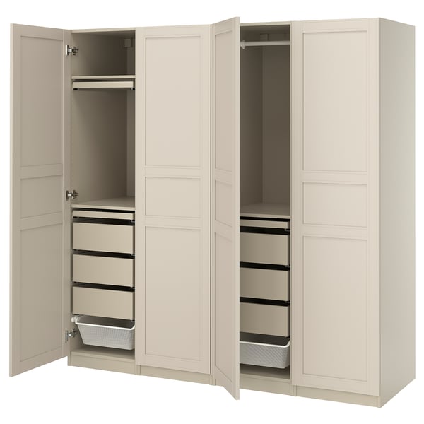 An open beige PAX wardrobe with drawers and shelves. It a sleek design with soft closing hinges.