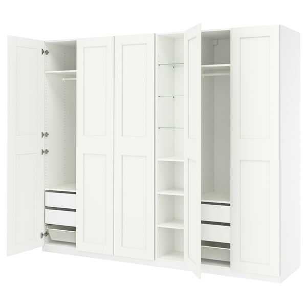 White PAX wardrobe with open doors, shelves, and drawers. Modern, minimalist design for organised storage.