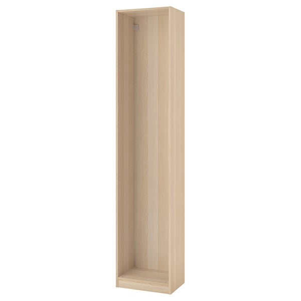 A PAX wardrobe frame in light oak. Its tall and rectangular with an open interior ready for organisers. The wood grain texture is visible.
