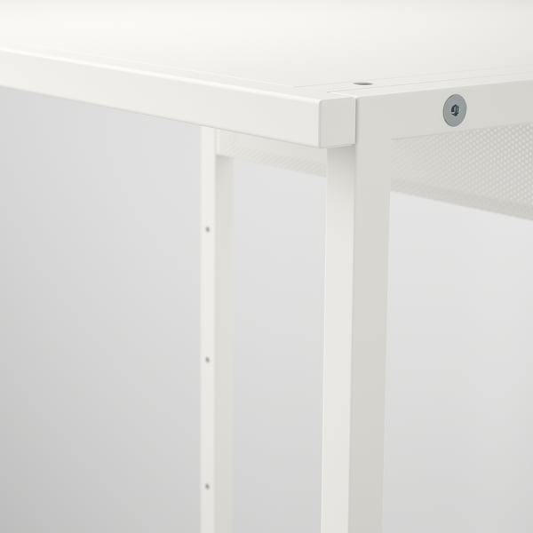 Close-up of a white metal shelfs sturdy, clean frame with visible locking mechanism, highlighting quality and design.