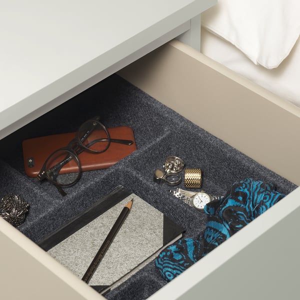 Open drawer with felt trays storing glasses, wallet, watch, pen, and scarf.